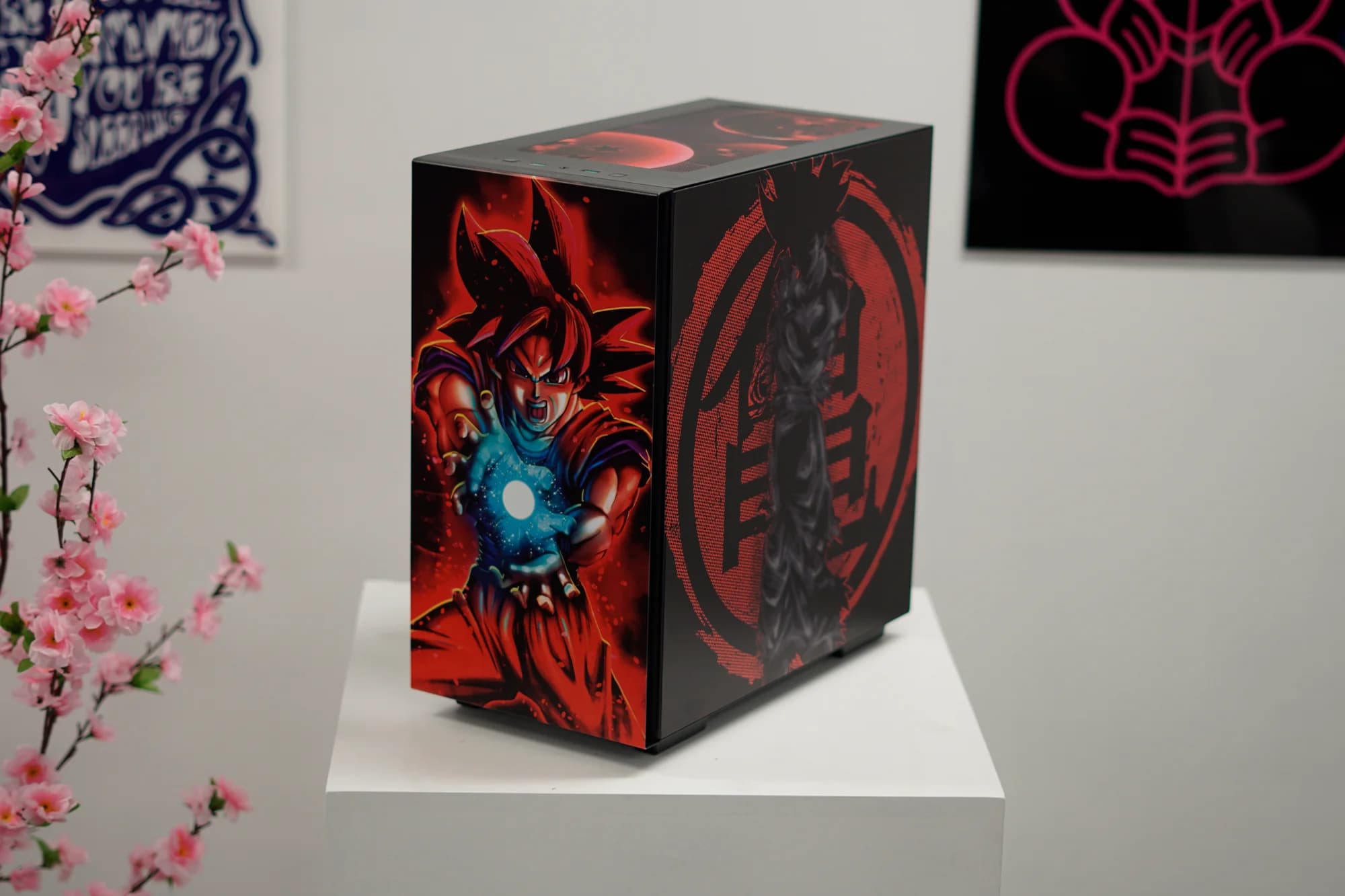 Decorative box with anime character design on a white pedestal against a light gray wall.