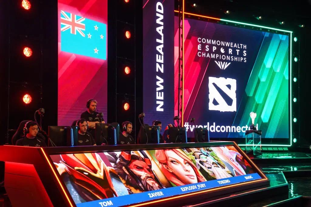 Stage with participants and large screens displaying 'Commonwealth Esports Championships' and New Zealand branding.